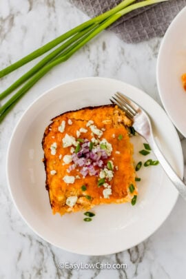 plated slice of Keto Buffalo Chicken Casserole with a fork.