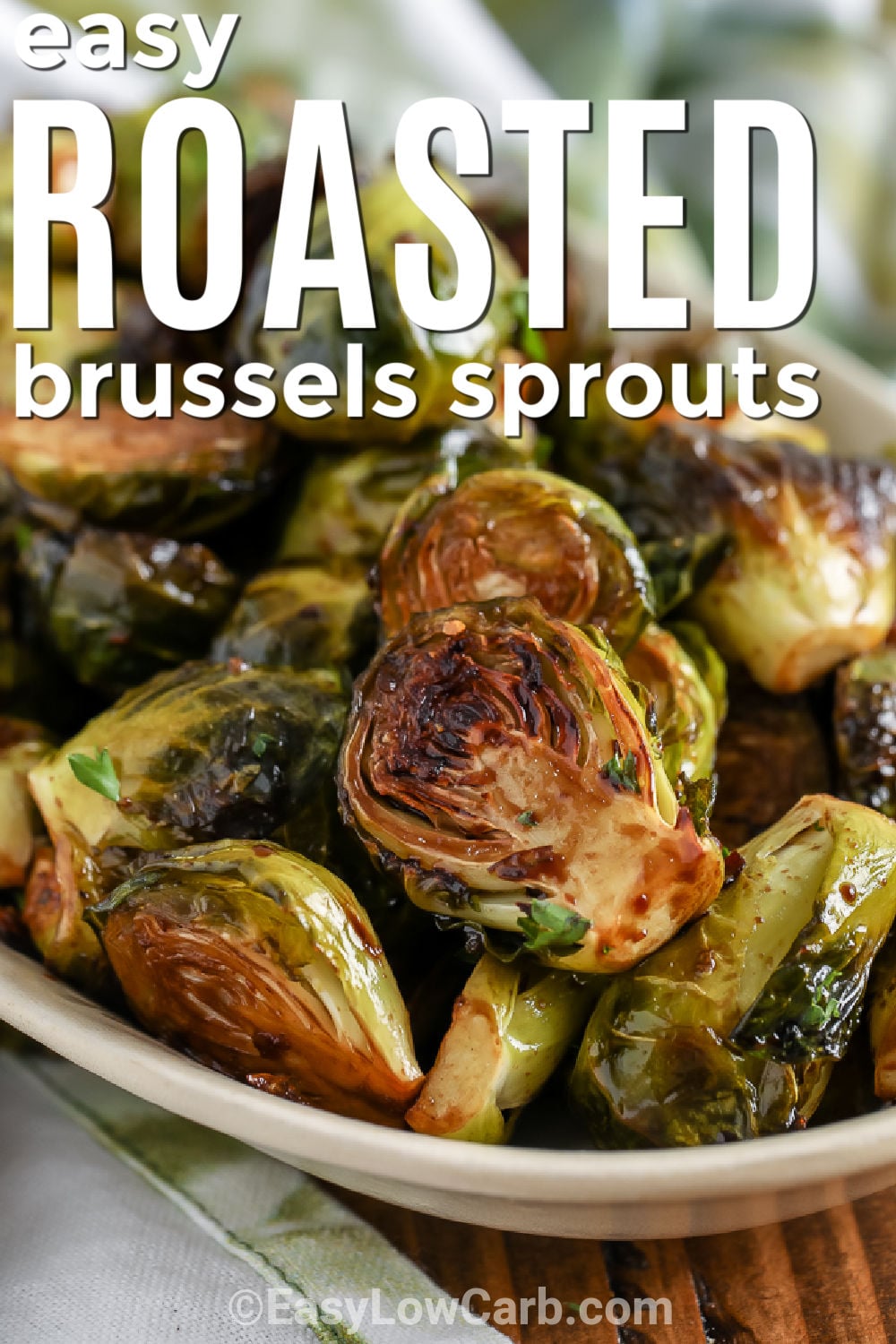 Balsamic roasted Brussels sprouts combine tangy balsamic vinegar, fresh garlic, and olive oil for a flavorful side without a complicated sauce. Roasting the Brussels sprouts cut-side down helps develop those deeply golden edges while keeping the centers tender. Ready in about 30 minutes, this easy low carb vegetable is practical for busy dinners and special occasions alike. Save this easy oven side to make with your favorite main dish. #easylowcarb bowl of Easy Roasted Brussels Sprouts with writing.