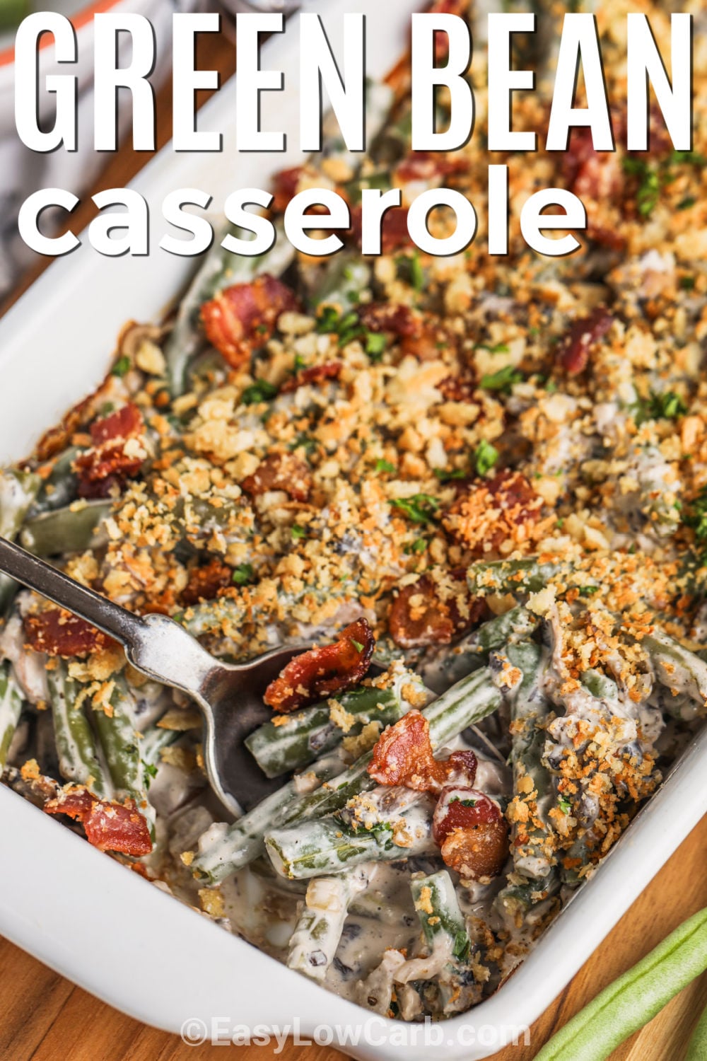 Enjoy keto green bean casserole as a creamy, flavorful side for your next holiday meal. This easy low carb casserole combines green beans with mushrooms, bacon, garlic, and a rich cream cheese sauce. Parmesan adds a savory finish, and an optional keto bread crumb topping gives the dish extra texture. It is comforting, family-friendly, and simple to prepare ahead. Add this classic-inspired side to your holiday menu today. #easylowcarb Keto Green Beans Casserole with bacon and writing.